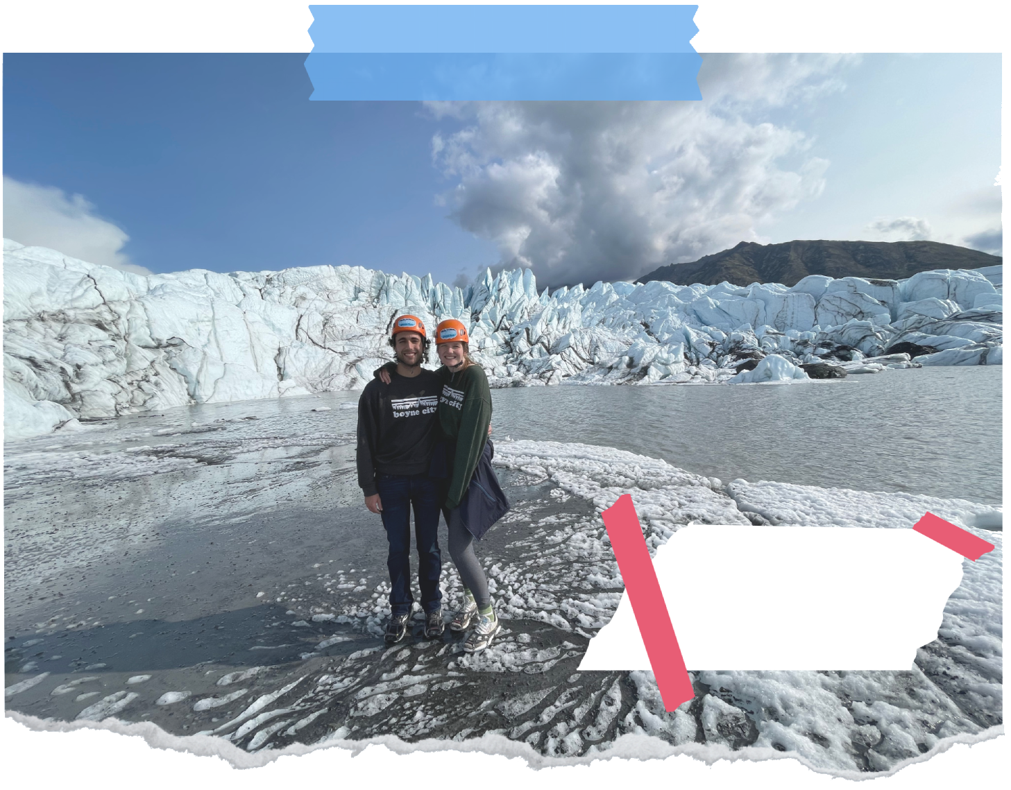 Image of a glacier with man and woman in the foreground